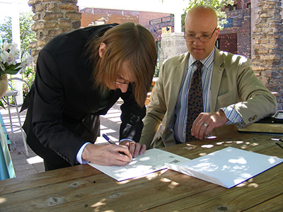 Sweetie signing the marriage certificate