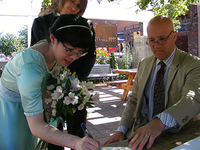 TK signing the marriage certificate