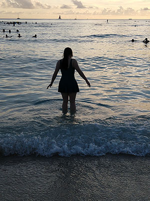 Tamara wading into the ocean